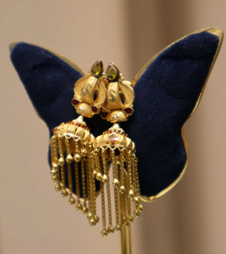 Gold jhumkas with long tassel drops