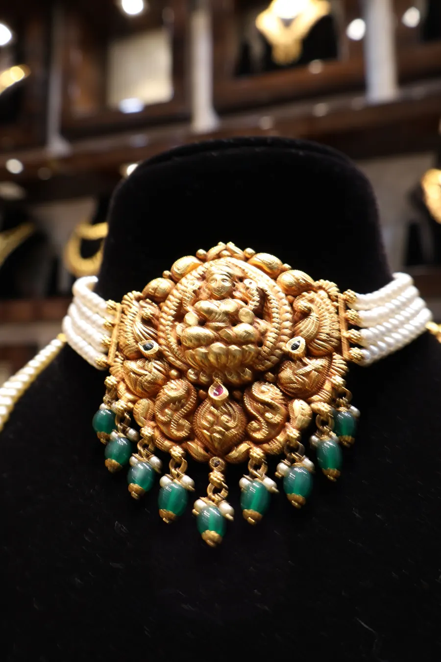A Lakshmi choker on pearl strands