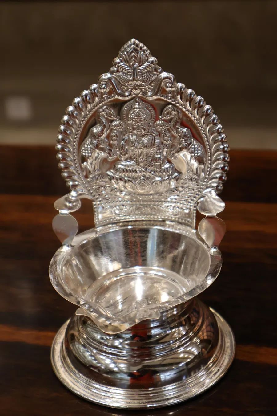 A silver Lakshmi deepam lamp