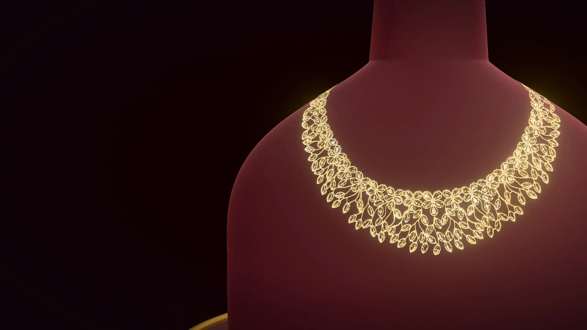 A filigree collar necklace from the Rajesh Jewellers counter on a garnet velvet bust, under a warm studio light