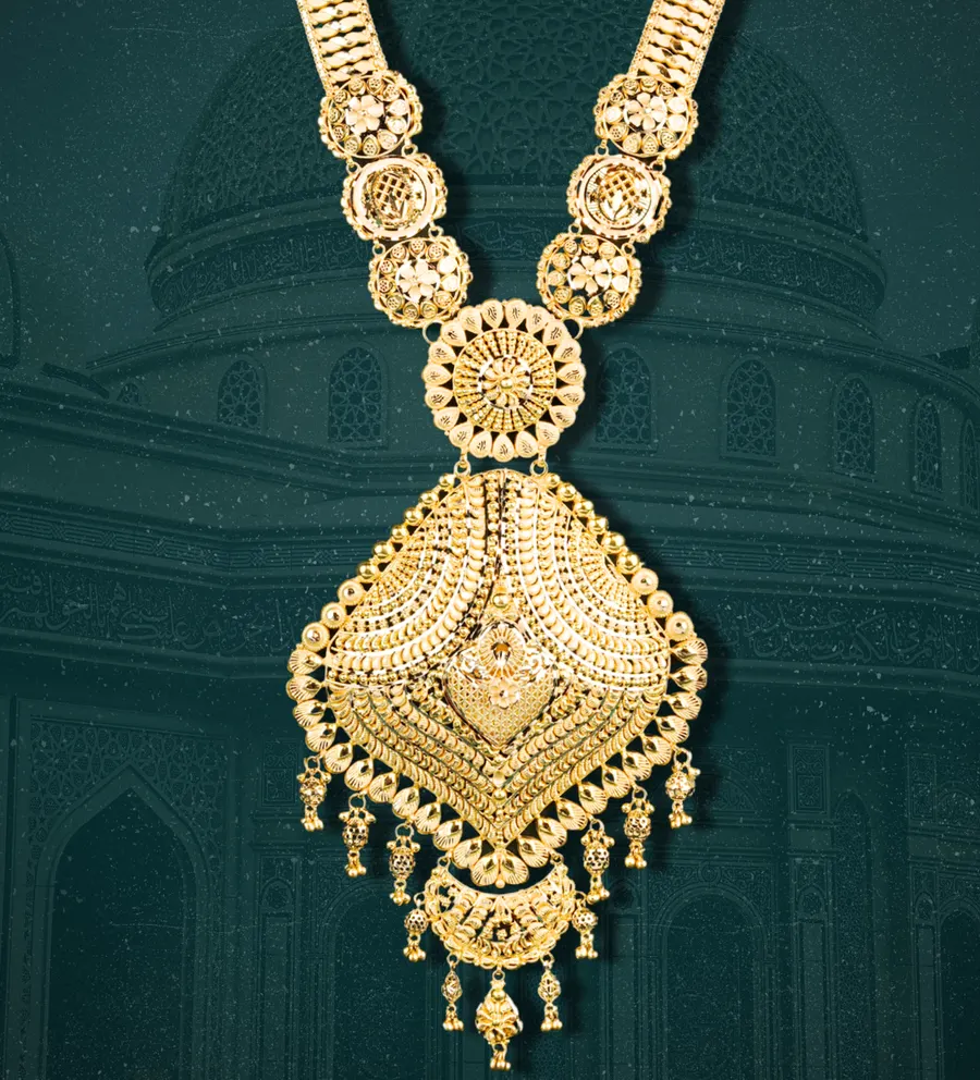 A long gold haram with a large pendant
