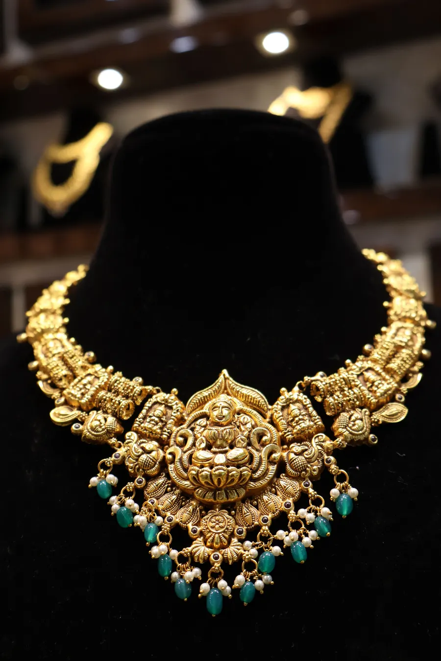 A temple necklace with a Lakshmi centre and bead drops